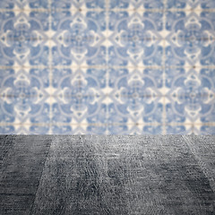 Image showing Wood table top and blur vintage ceramic tile pattern wall