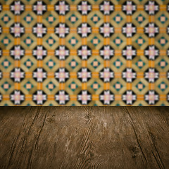 Image showing Wood table top and blur vintage ceramic tile pattern wall