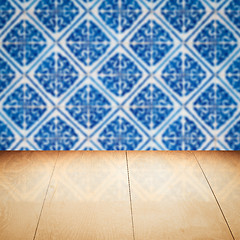 Image showing Wood table top and blur vintage ceramic tile pattern wall