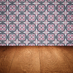 Image showing Wood table top and blur vintage ceramic tile pattern wall