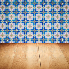 Image showing Wood table top and blur vintage ceramic tile pattern wall