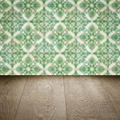 Image showing Wood table top and blur vintage ceramic tile pattern wall