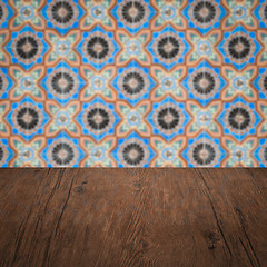 Image showing Wood table top and blur vintage ceramic tile pattern wall