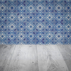 Image showing Wood table top and blur vintage ceramic tile pattern wall