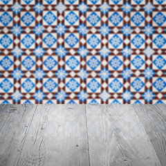 Image showing Wood table top and blur vintage ceramic tile pattern wall