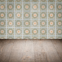 Image showing Wood table top and blur vintage ceramic tile pattern wall