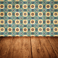 Image showing Wood table top and blur vintage ceramic tile pattern wall