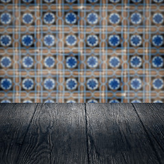 Image showing Wood table top and blur vintage ceramic tile pattern wall