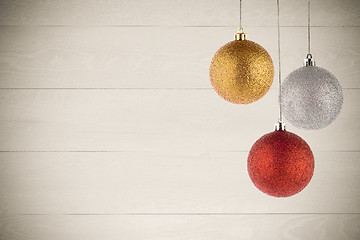 Image showing Three Christmas Balls Hanging