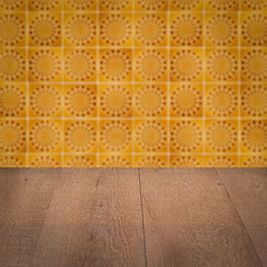 Image showing Wood table top and blur vintage ceramic tile pattern wall