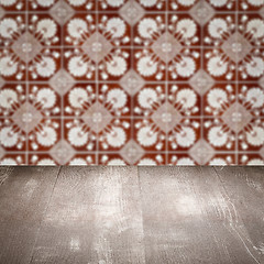 Image showing Wood table top and blur vintage ceramic tile pattern wall