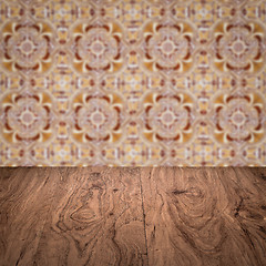 Image showing Wood table top and blur vintage ceramic tile pattern wall