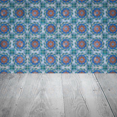 Image showing Wood table top and blur vintage ceramic tile pattern wall