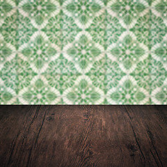 Image showing Wood table top and blur vintage ceramic tile pattern wall