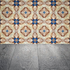 Image showing Wood table top and blur vintage ceramic tile pattern wall