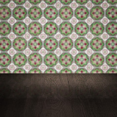 Image showing Wood table top and blur vintage ceramic tile pattern wall