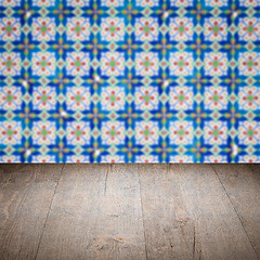 Image showing Wood table top and blur vintage ceramic tile pattern wall