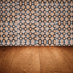 Image showing Wood table top and blur vintage ceramic tile pattern wall