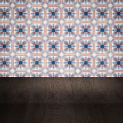 Image showing Wood table top and blur vintage ceramic tile pattern wall