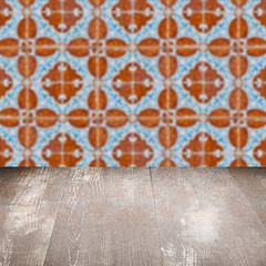 Image showing Wood table top and blur vintage ceramic tile pattern wall