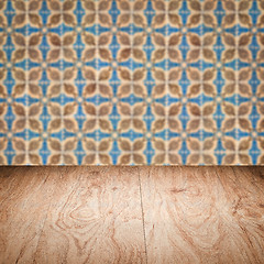 Image showing Wood table top and blur vintage ceramic tile pattern wall