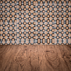 Image showing Wood table top and blur vintage ceramic tile pattern wall