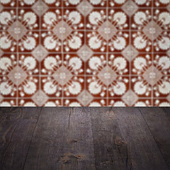 Image showing Wood table top and blur vintage ceramic tile pattern wall