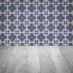 Image showing Wood table top and blur vintage ceramic tile pattern wall