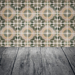 Image showing Wood table top and blur vintage ceramic tile pattern wall