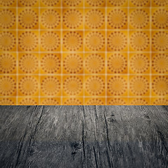 Image showing Wood table top and blur vintage ceramic tile pattern wall