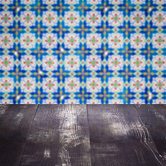 Image showing Wood table top and blur vintage ceramic tile pattern wall