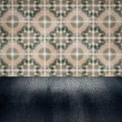 Image showing Wood table top and blur vintage ceramic tile pattern wall