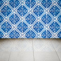 Image showing Wood table top and blur vintage ceramic tile pattern wall