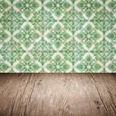 Image showing Wood table top and blur vintage ceramic tile pattern wall