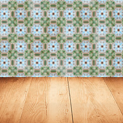 Image showing Wood table top and blur vintage ceramic tile pattern wall