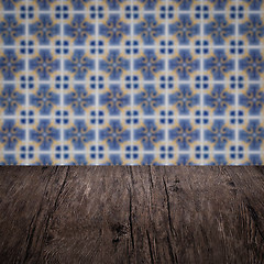 Image showing Wood table top and blur vintage ceramic tile pattern wall