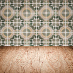 Image showing Wood table top and blur vintage ceramic tile pattern wall