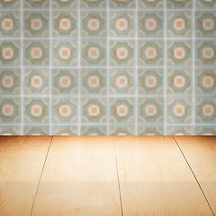 Image showing Wood table top and blur vintage ceramic tile pattern wall