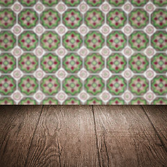 Image showing Wood table top and blur vintage ceramic tile pattern wall