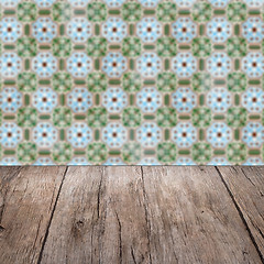 Image showing Wood table top and blur vintage ceramic tile pattern wall