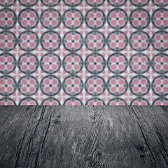 Image showing Wood table top and blur vintage ceramic tile pattern wall