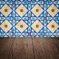 Image showing Wood table top and blur vintage ceramic tile pattern wall