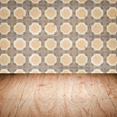 Image showing Wood table top and blur vintage ceramic tile pattern wall