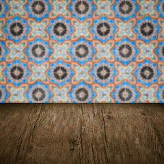 Image showing Wood table top and blur vintage ceramic tile pattern wall