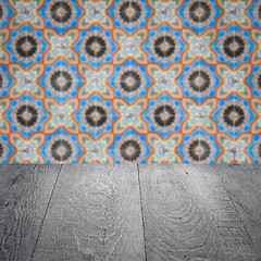 Image showing Wood table top and blur vintage ceramic tile pattern wall