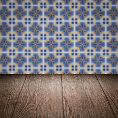 Image showing Wood table top and blur vintage ceramic tile pattern wall