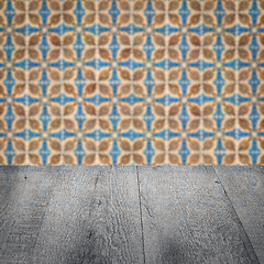 Image showing Wood table top and blur vintage ceramic tile pattern wall