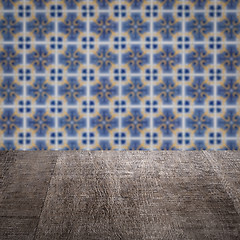 Image showing Wood table top and blur vintage ceramic tile pattern wall