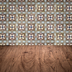 Image showing Wood table top and blur vintage ceramic tile pattern wall