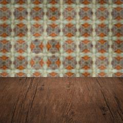 Image showing Wood table top and blur vintage ceramic tile pattern wall